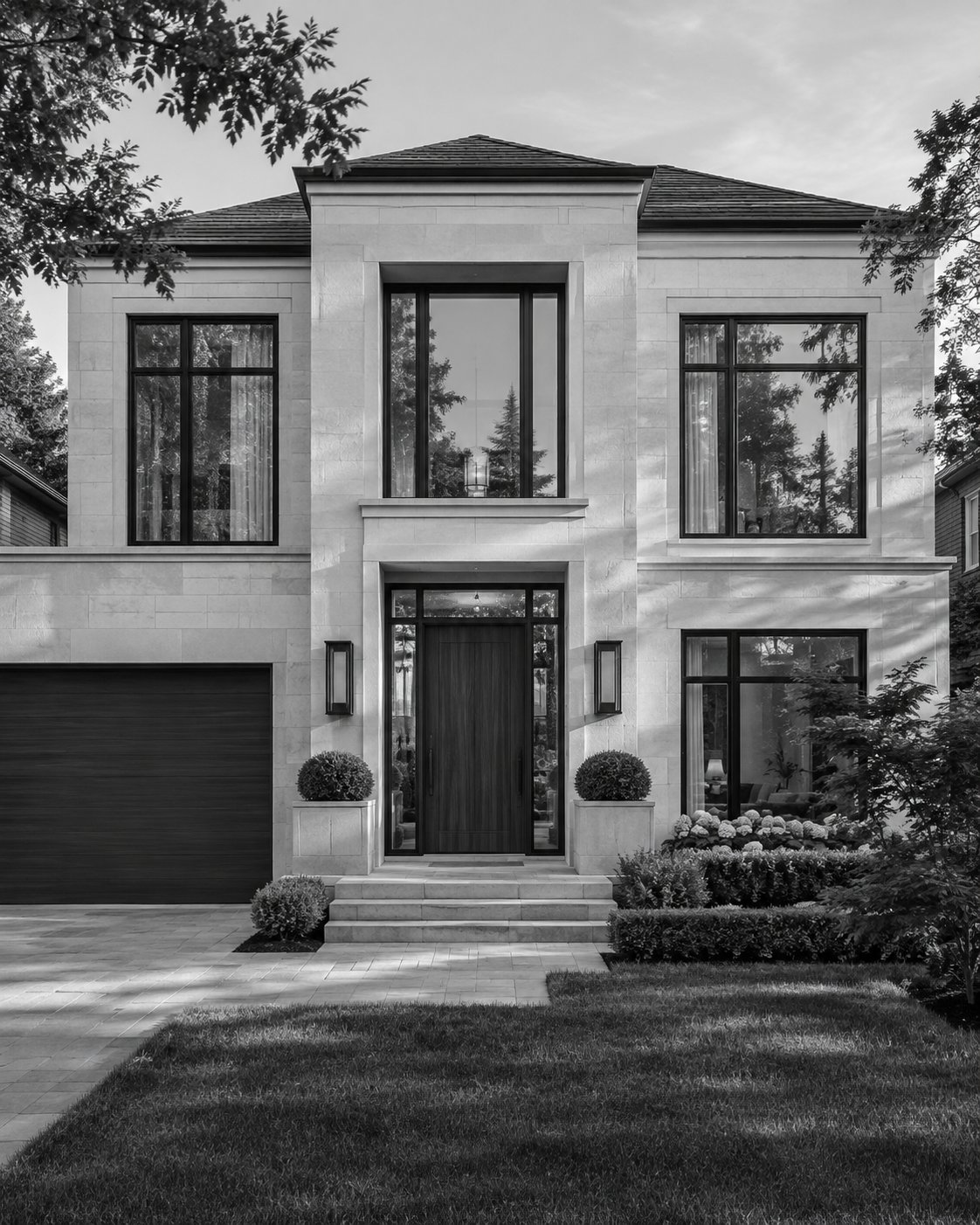 A contemporary stone residence with tall windows